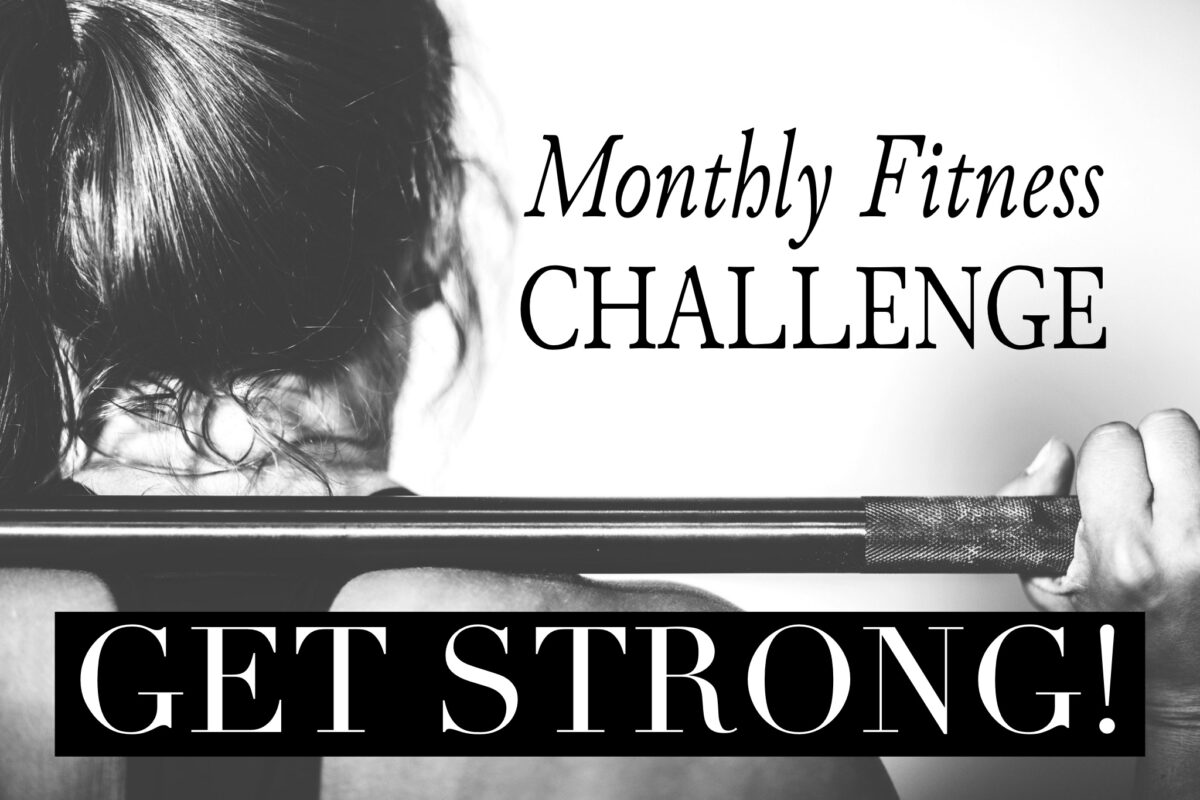 woman holding barbell get strong monthly fitness challenge