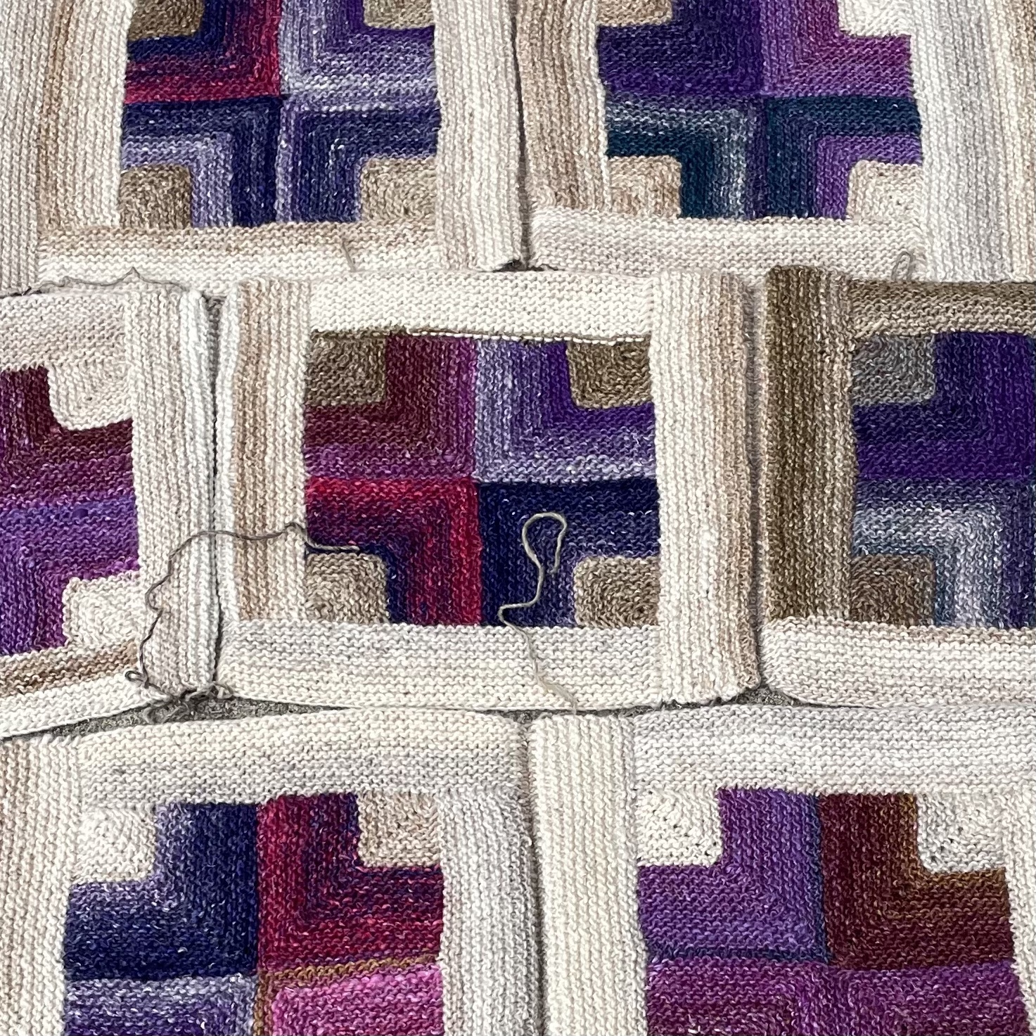 close up view of hand knit squares