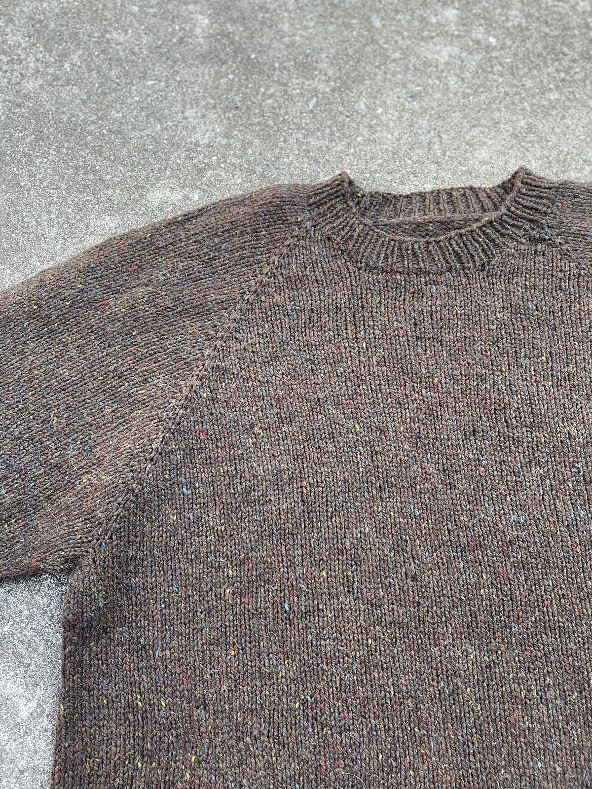 close up view of brown men's pullover sweater