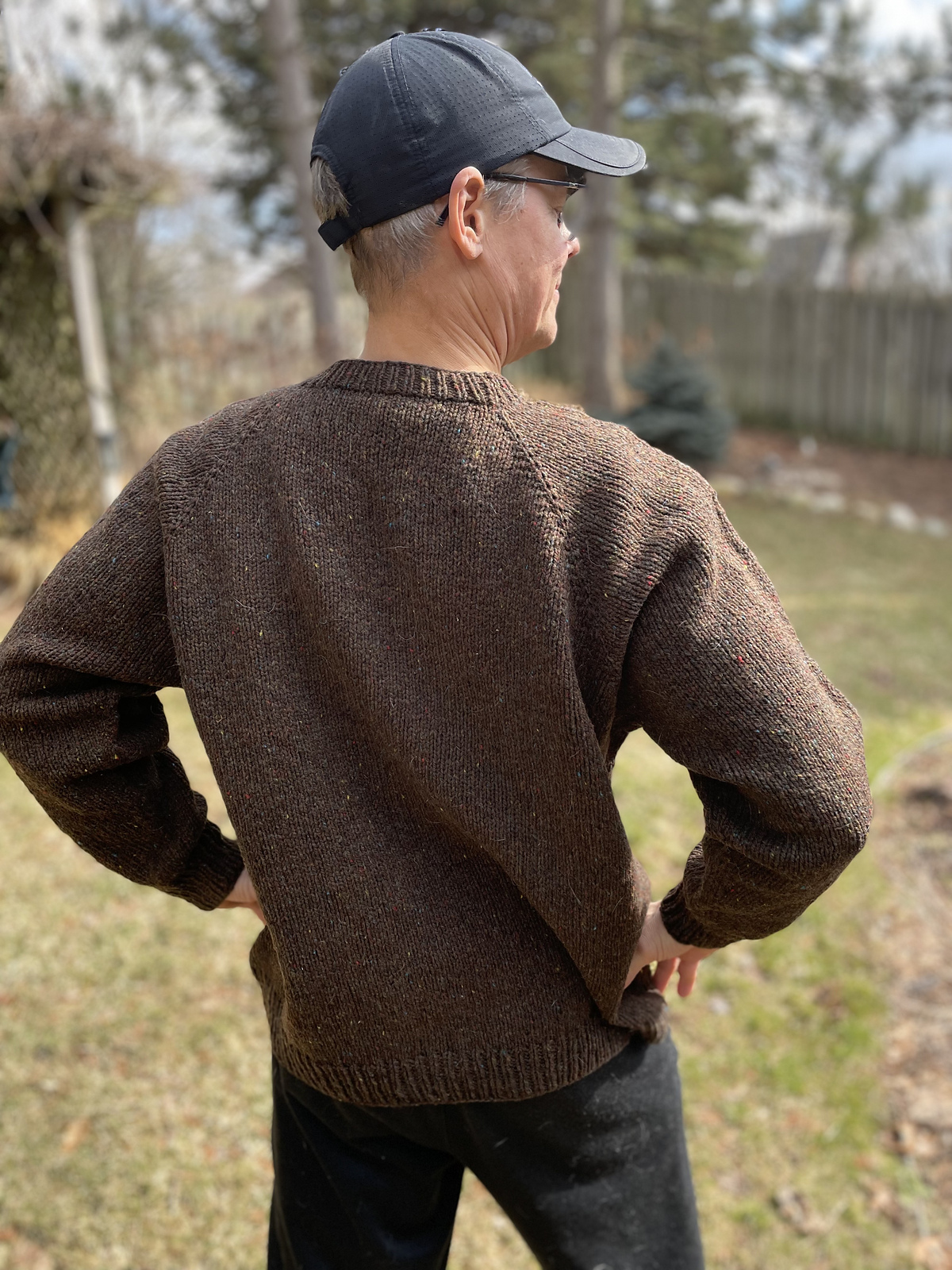 man wearing brown pullover sweater